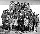 School children in Concentration Camp in Ferramonti with Rabbi Pacifici of Genoa. 1941.